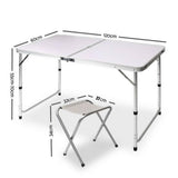 A portable aluminium folding picnic table with matching chair set up, all in a metallic colour and showing the dimensions