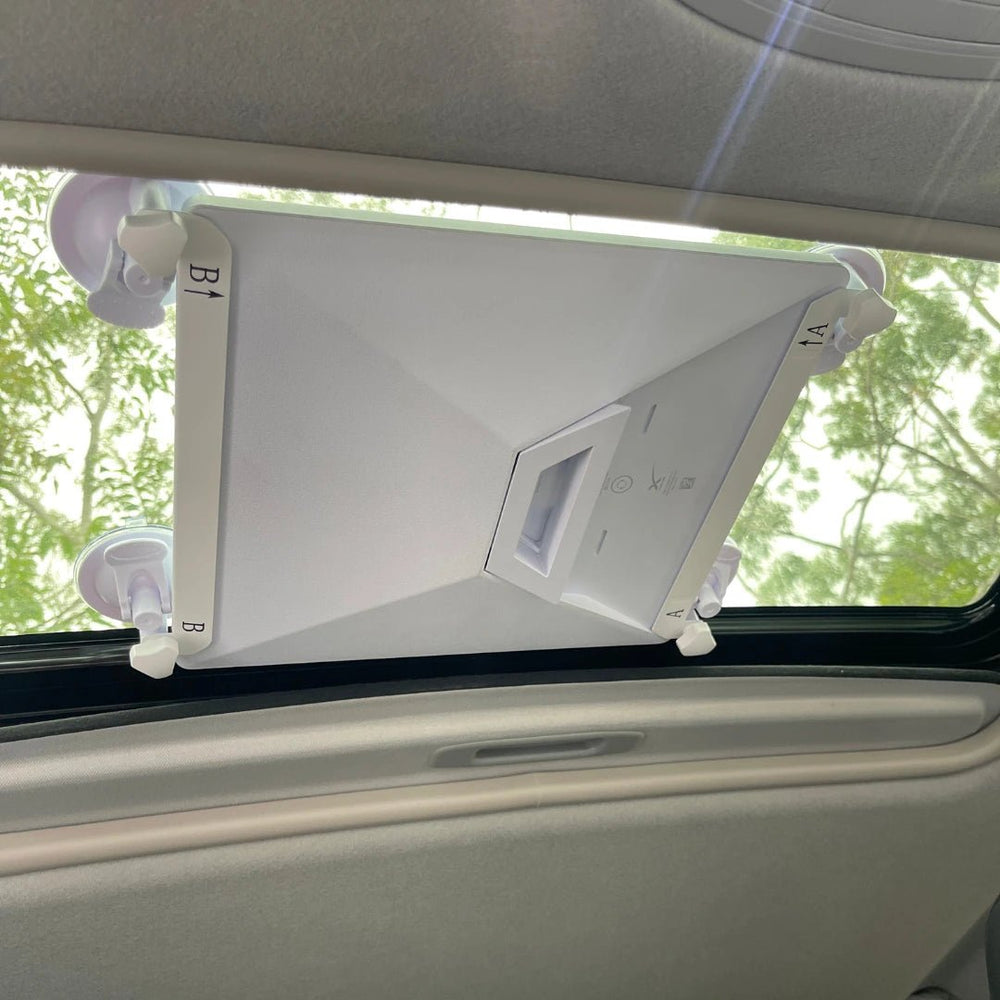 Close-up of industrial suction cups locked onto glass holding the Starlink Mini mount firmly in place