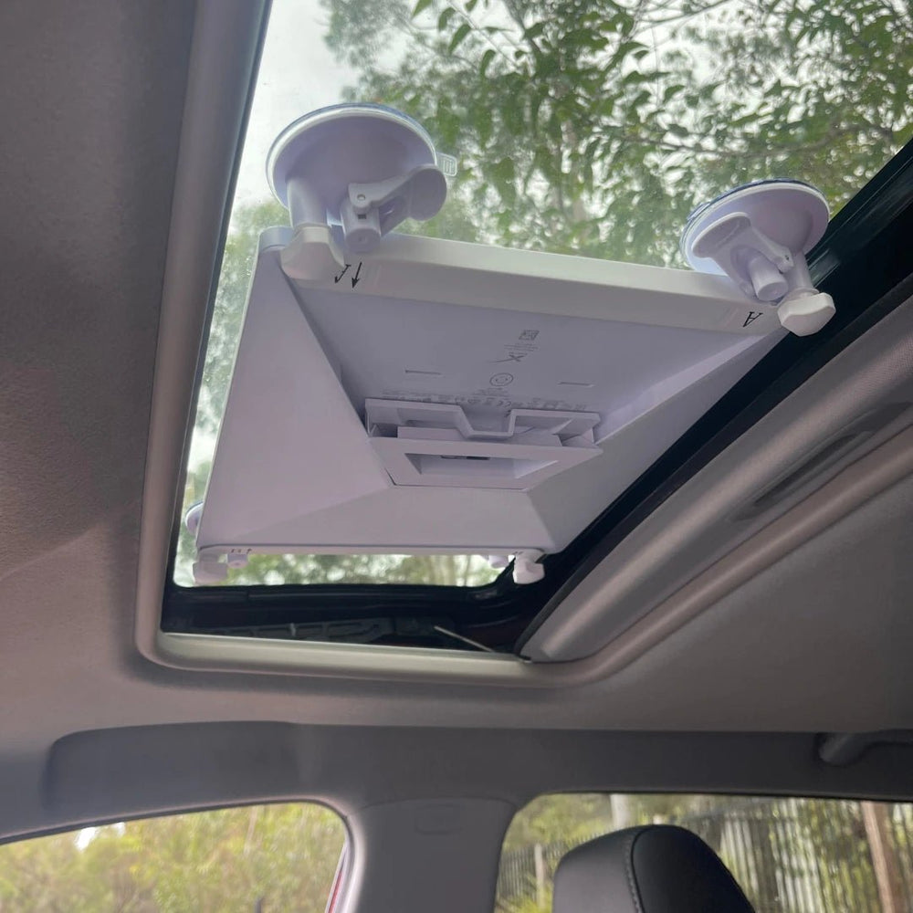 Starlink Mini mounted securely to a car sunroof using a heavy-duty suction mount for portable satellite internet