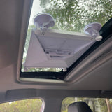 Starlink Mini mounted securely to a car sunroof using a heavy-duty suction mount for portable satellite internet