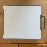 Top view of Starlink Mini dish attached to magnetic roof mount with integrated carry handle