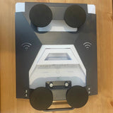 Underside of Starlink Mini magnetic roof mount showing four heavy-duty rubber coated magnets for secure hold