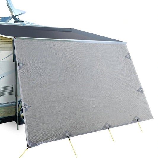 Grey caravan privacy screen front wall attached to a motorhome roll awning