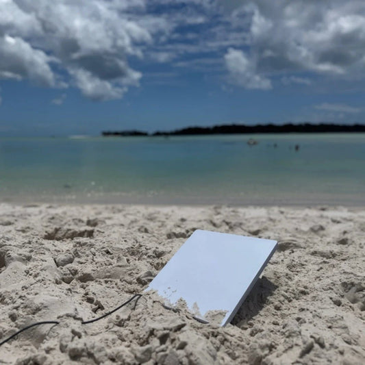 Starlink dish operating on a beach using off grid power during remote travel