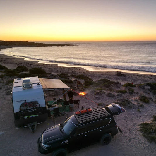 family caravan setup beside the beach during a Big Lap road trip around Australia