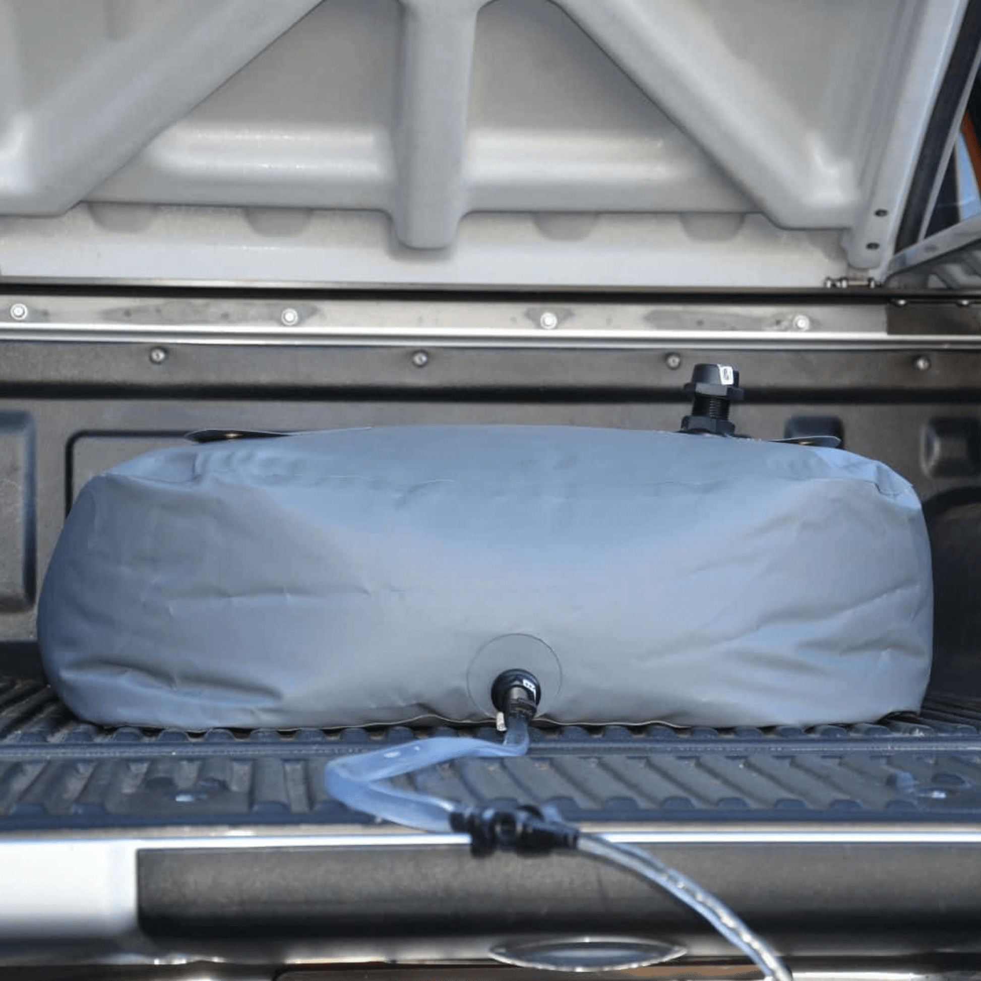 Fleximake DW200B 200L drinking water bladder in the tray of a ute or pick-up