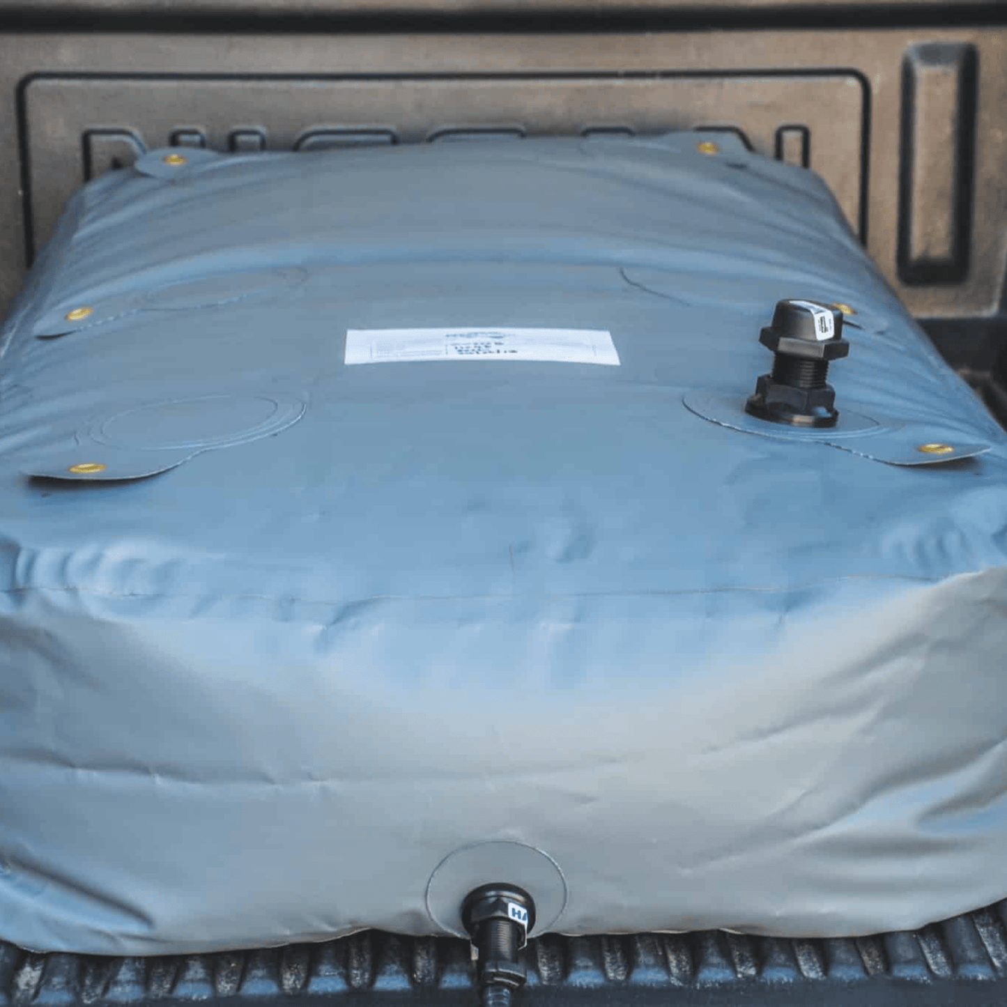 Fleximake DW200B 200L drinking water bladder in the tray of a ute or pick-up
