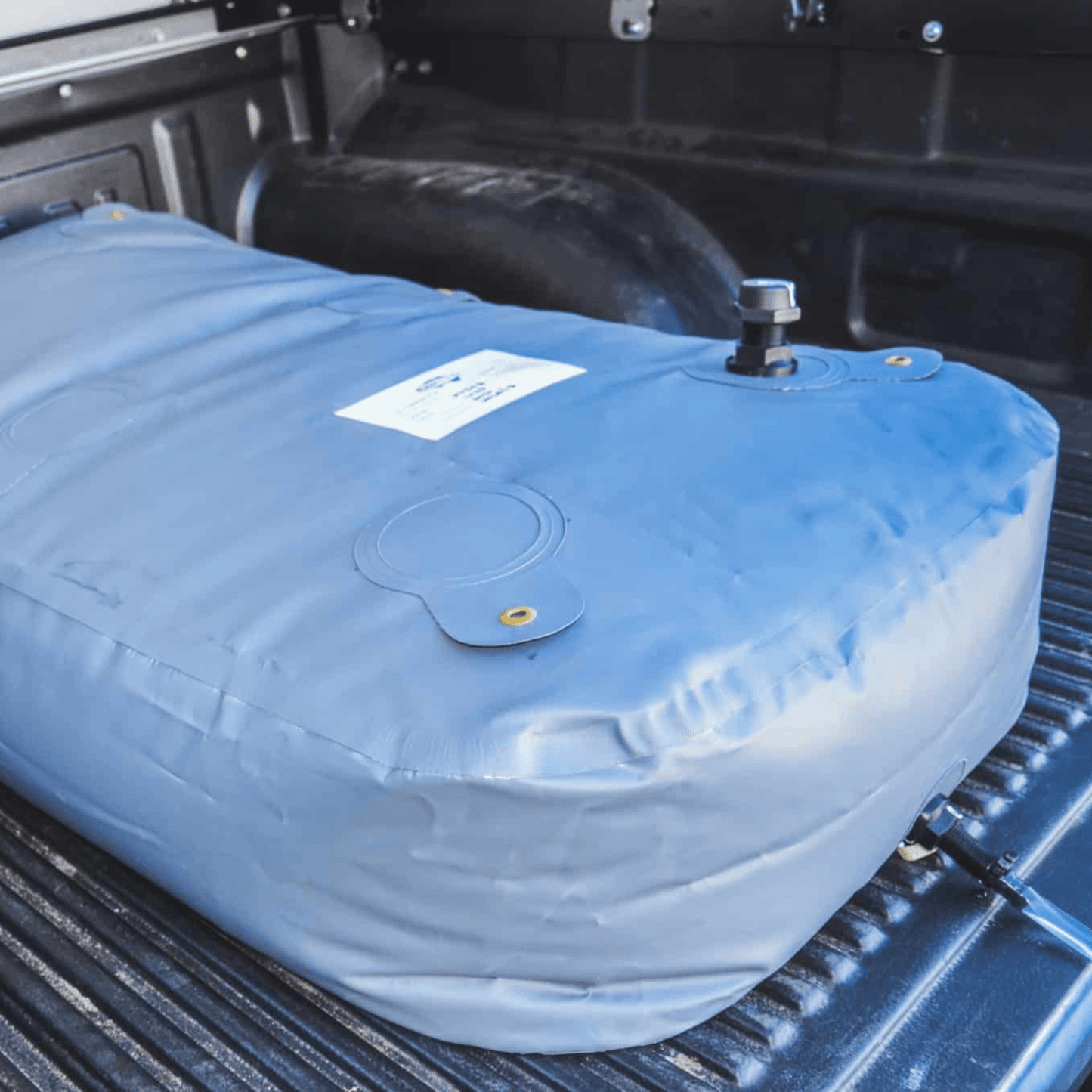 Fleximake DW200B 200L drinking water bladder in the tray of a ute or pick-up