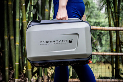 Person holding a Cybertake outdoor air conditioner