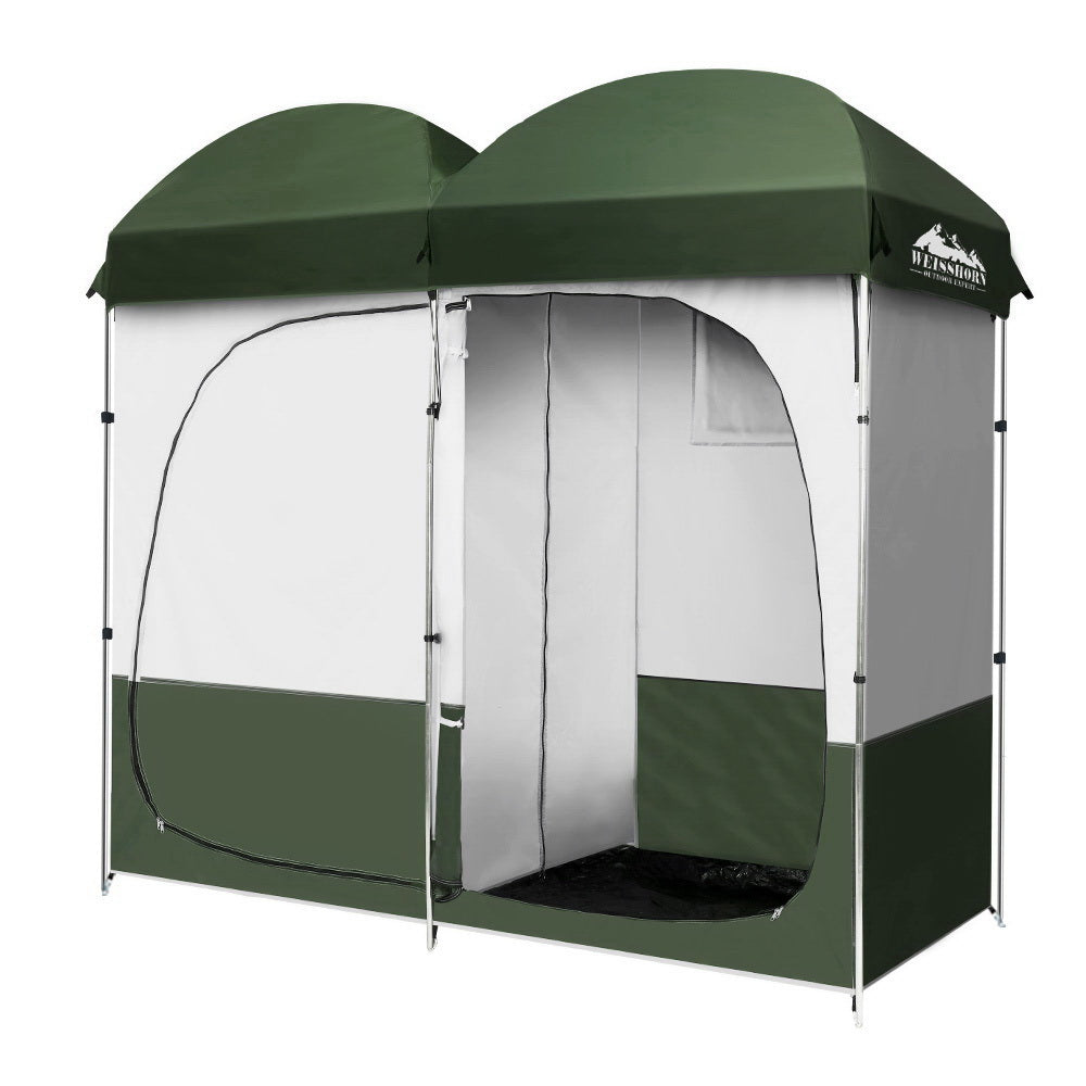 A green Weisshorn Double Camping Shower Toilet Tent with a large double-sided zippered door, set up outdoors.