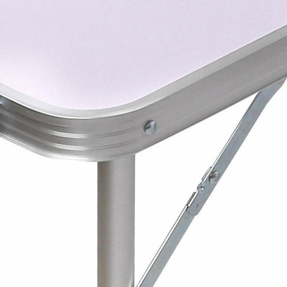 A portable aluminium folding picnic table close up