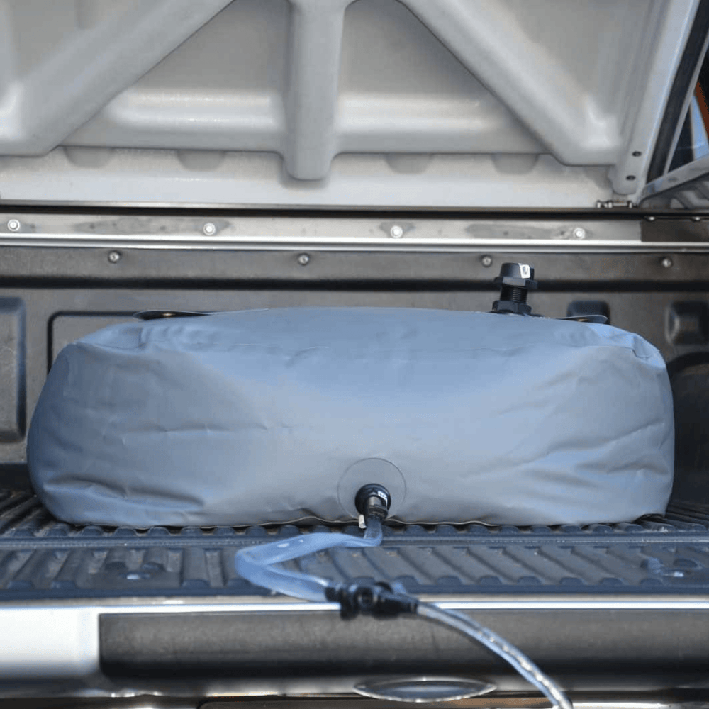 Fleximake DW200B 200L drinking water bladder in the tray of a ute or pick-up
