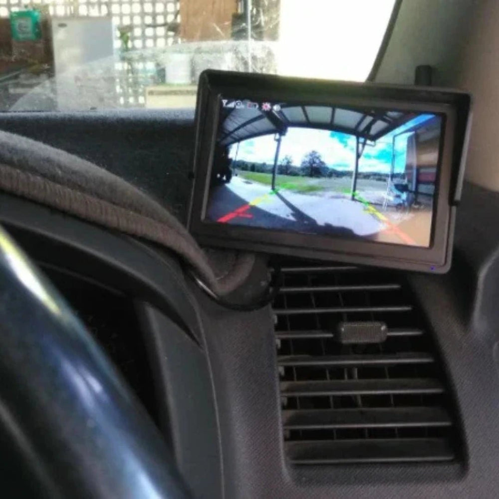 rearview170 5-inch HD monitor mounted on vehicle dash vent showing live wide angle rear view with coloured parking guidelines