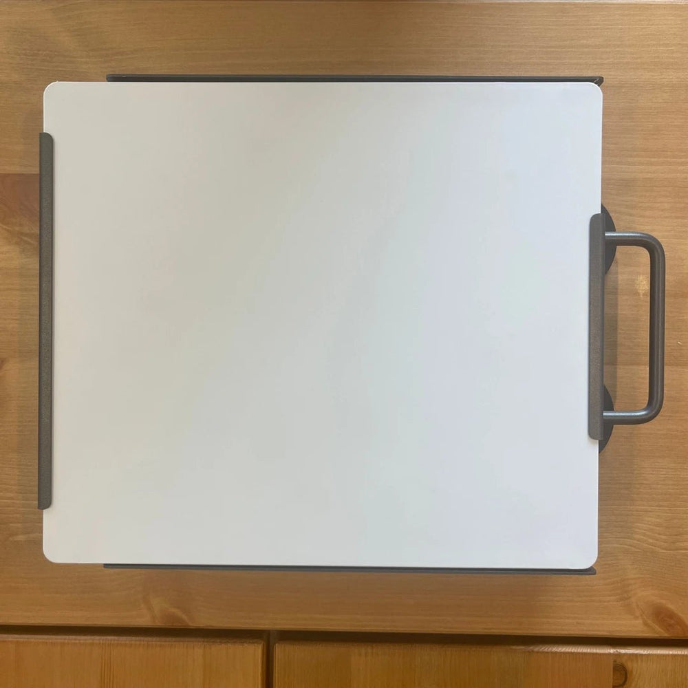 Top view of Starlink Mini dish attached to magnetic roof mount with integrated carry handle