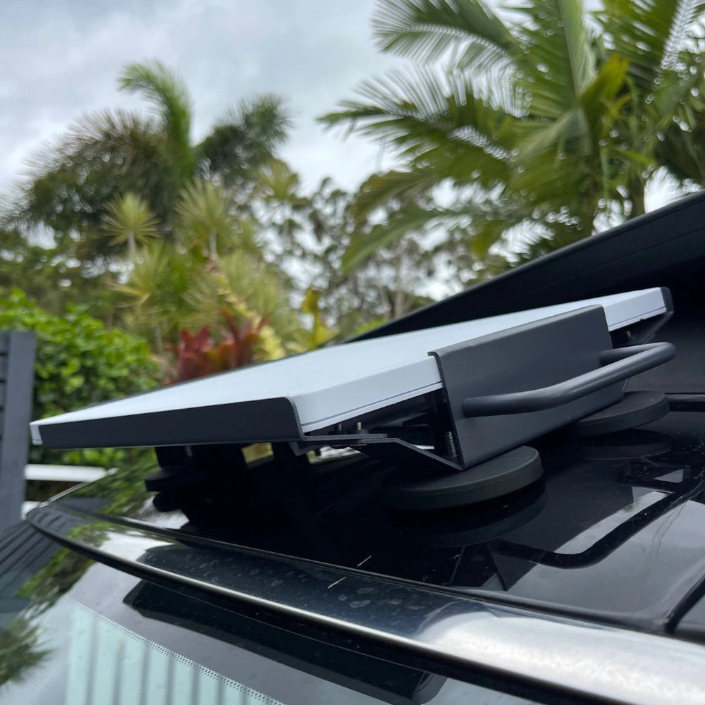 Starlink Mini mounted on magnetic roof mount installed on a black 4WD for portable off-grid internet