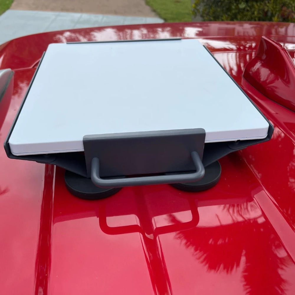 Front view of Starlink Mini secured on portable magnetic roof mount ready for travel and camping use