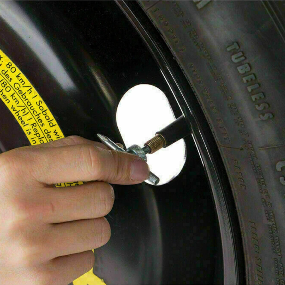 Using 4-Way Tyre Valve Tool to Remove Valve Core on Car Wheel