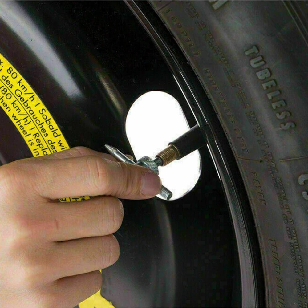 Using 4-Way Tyre Valve Tool to Remove Valve Core on Car Wheel